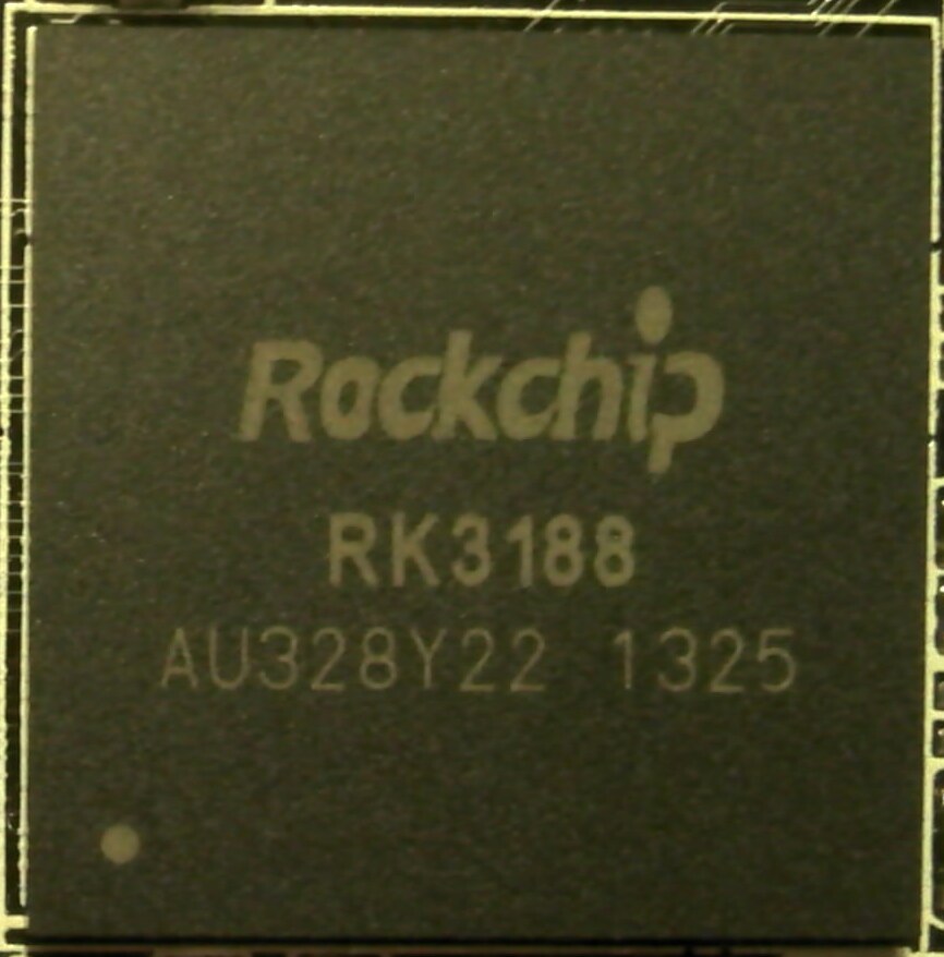 Close-up photograph of a Rockchip RK3188 processor inside an older MK809III device